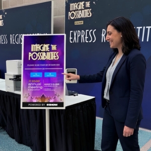 Woman at onsite check-in kiosk